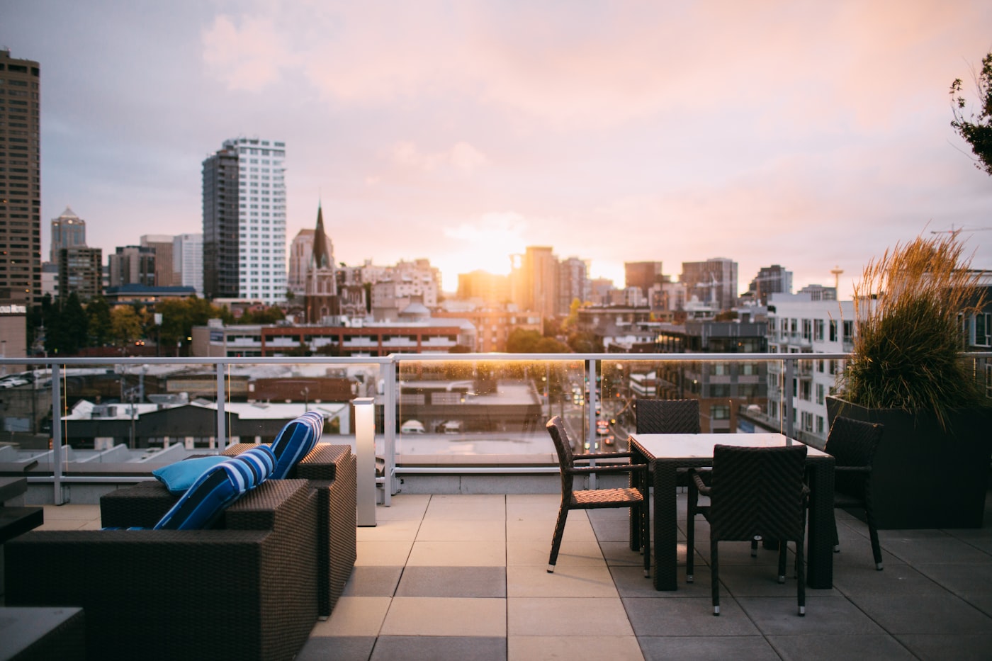 The Condo Life rooftop terrace at golden hour overlooking the city